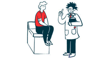 A doctor holds and clipboard and gestures while speaking with a patient seated on an examining table.